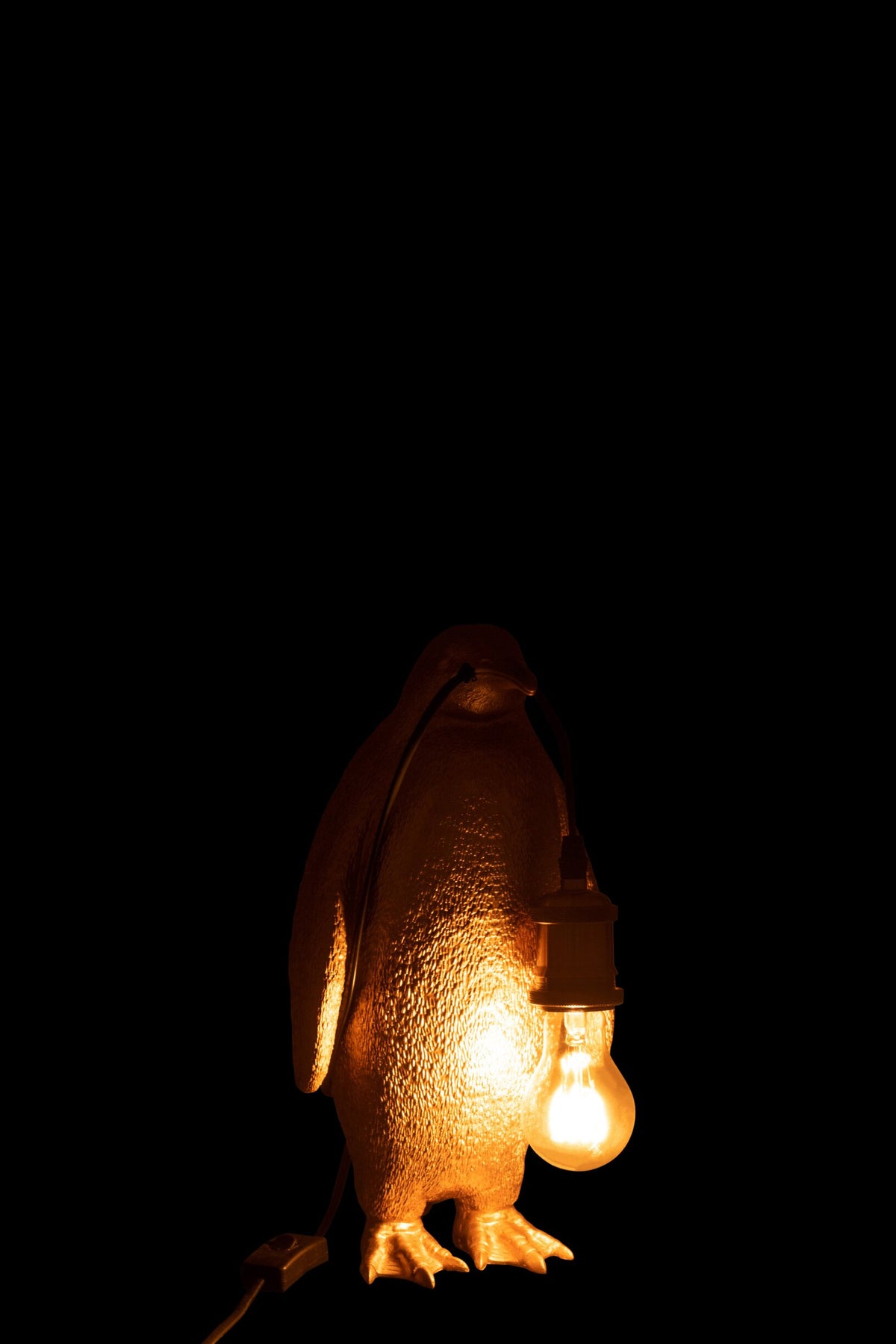 Petite lampe de table pingouin en résine dorée