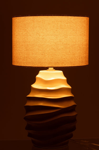 Table lamp with swooping beige ceramic